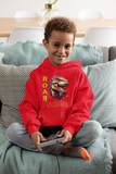 Child relaxing on a sofa wearing a vibrant red ROARSOME kids dinosaur hoodie.